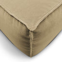 Dettaglio angolo divano Docker in velluto beige